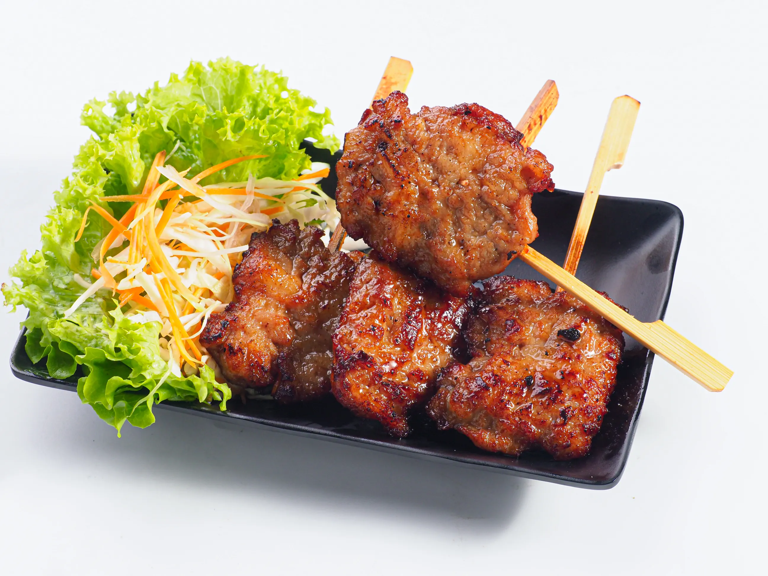 Grilled pork satay skewers restaurant food photography Singapore